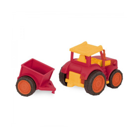 tracteur rouge avec remorque détachée